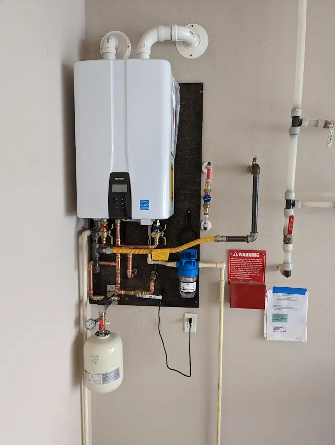 Professional plumber installing copper piping in a Avondale Estates home